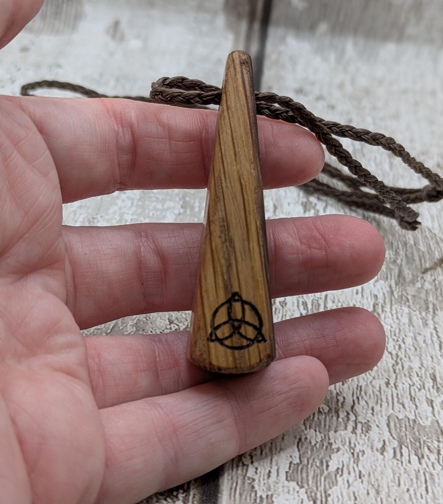 Whiskey barrel oak roimata tear drop triskele pendant.