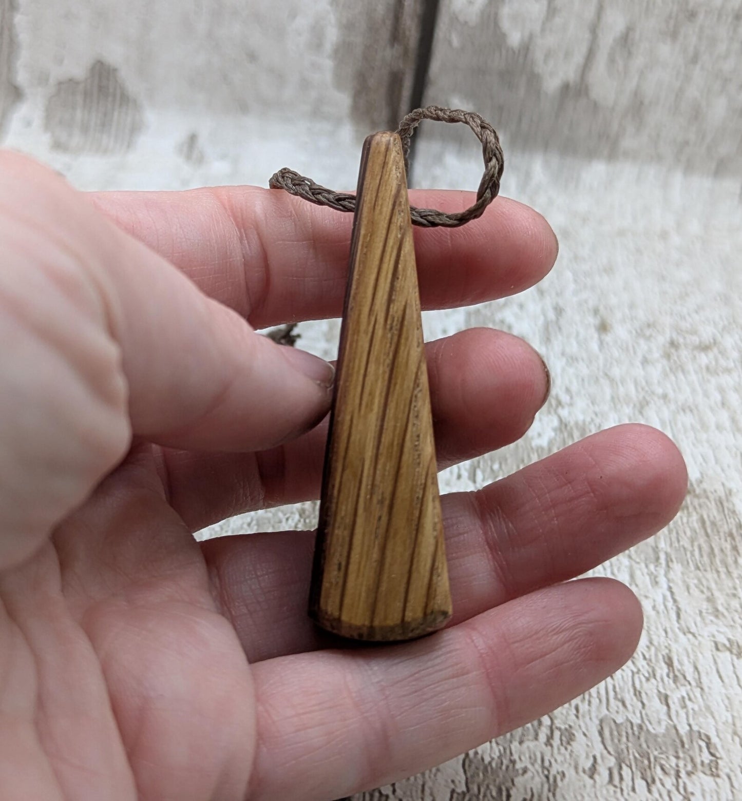 Whiskey barrel oak roimata tear drop triskele pendant.