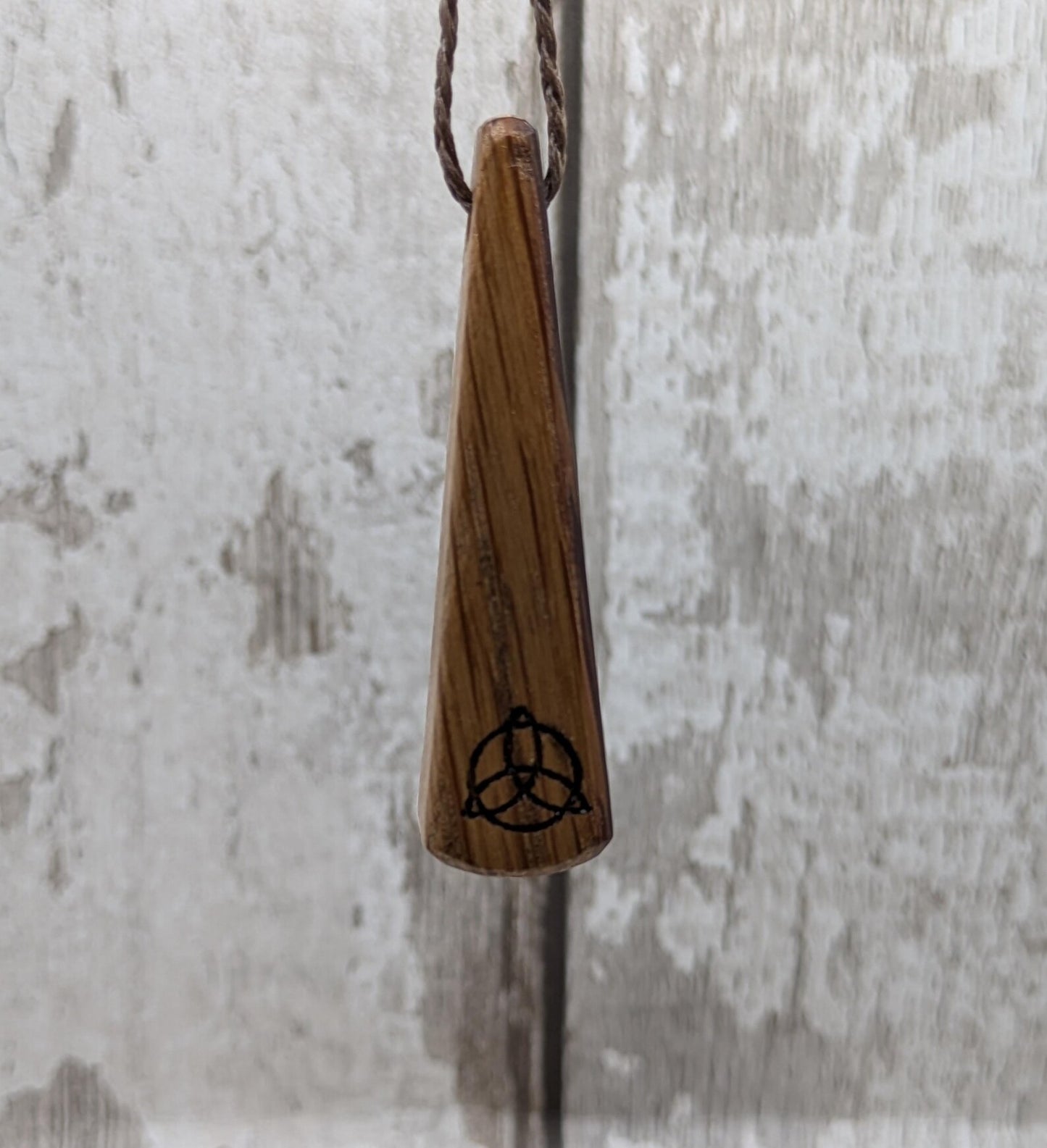Whiskey barrel oak roimata tear drop triskele pendant.