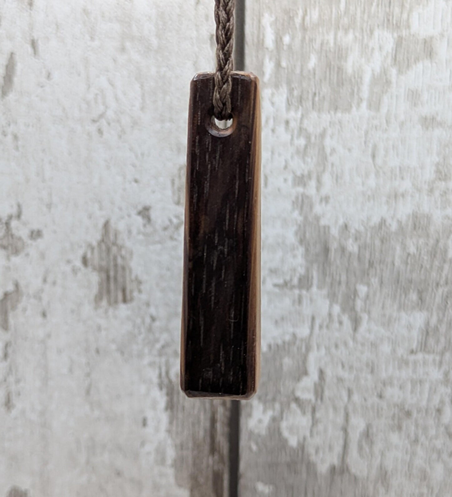 Whiskey barrel oak roimata tear drop triskele pendant.