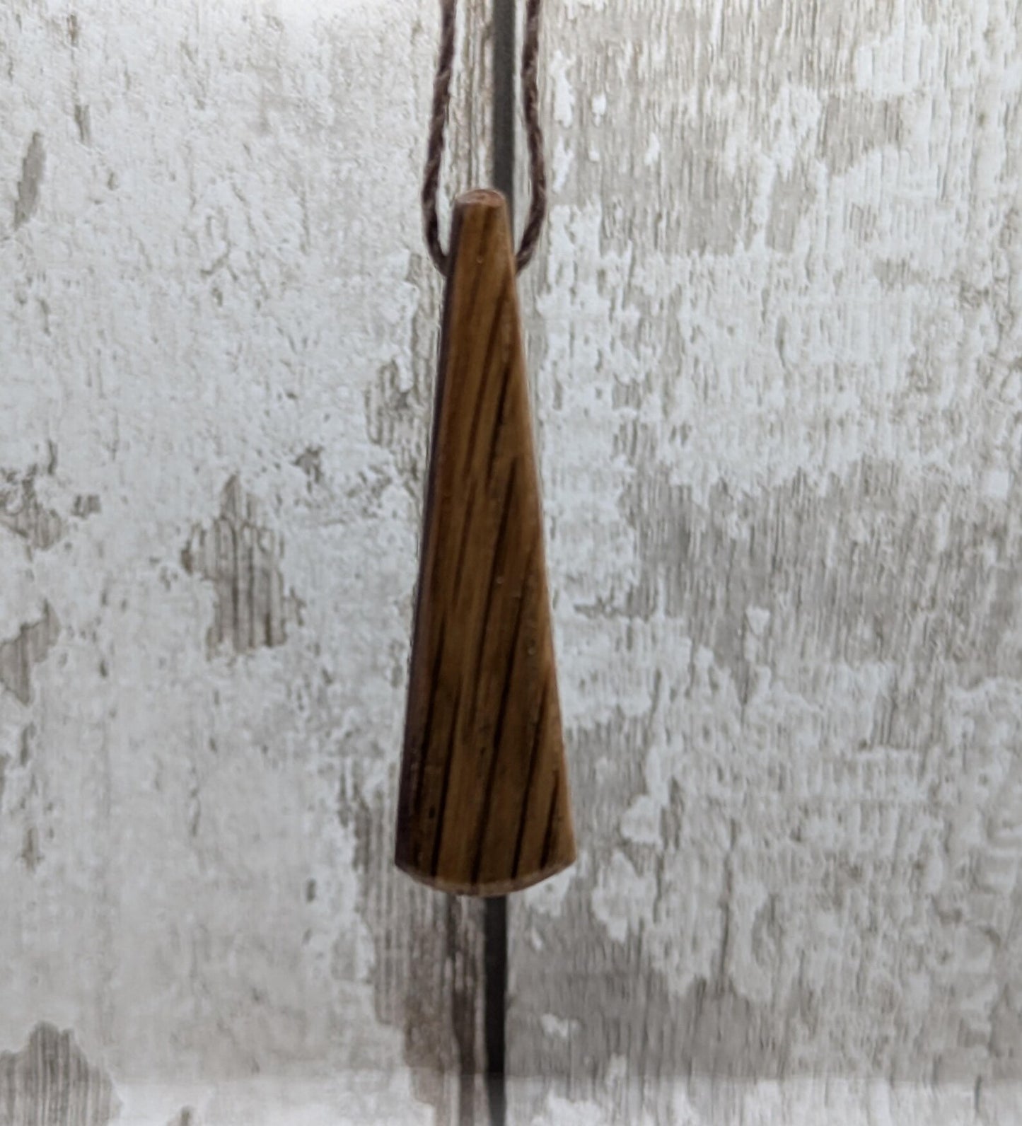 Whiskey barrel oak roimata tear drop triskele pendant.
