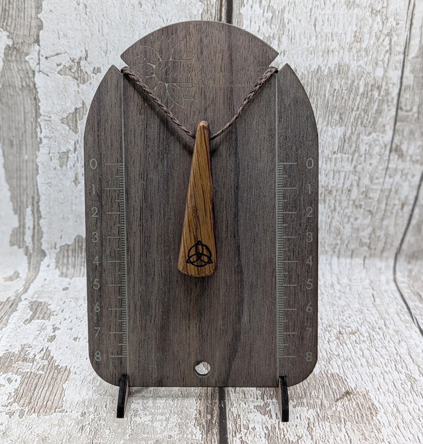 Whiskey barrel oak roimata tear drop triskele pendant.
