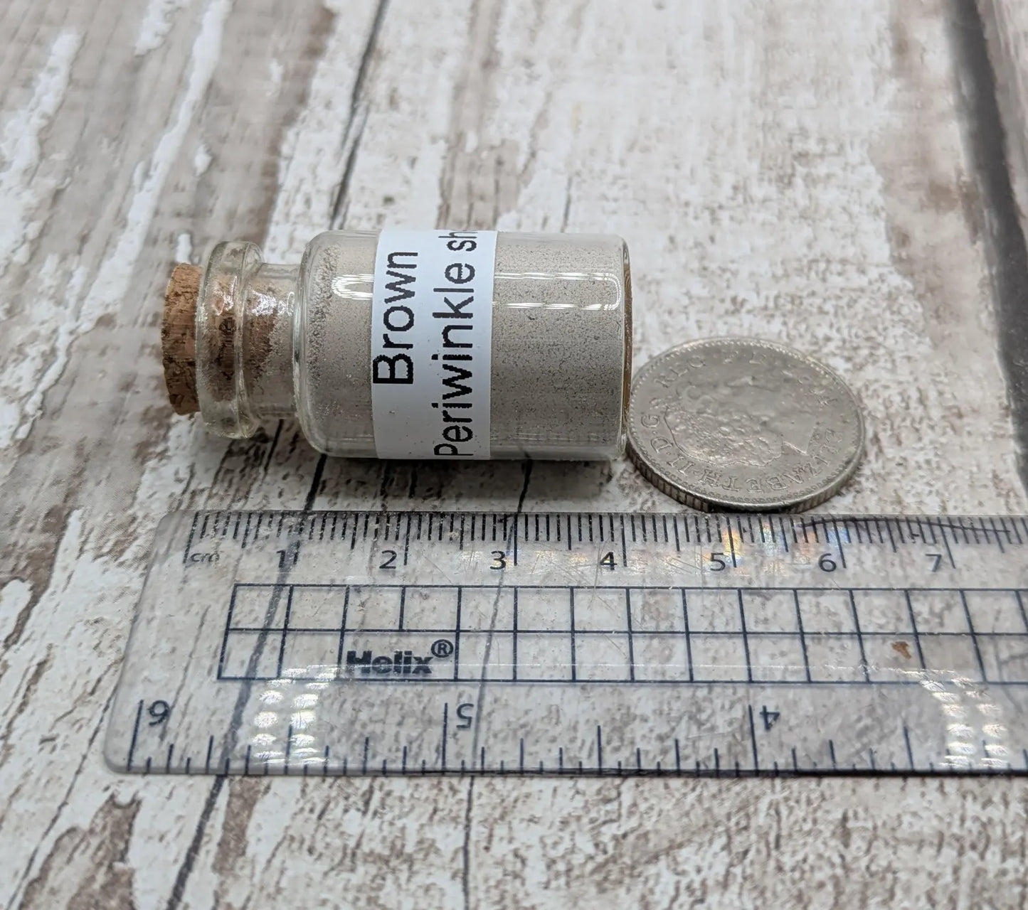 Unrefined powdered brown periwinkle shell paint pigment.