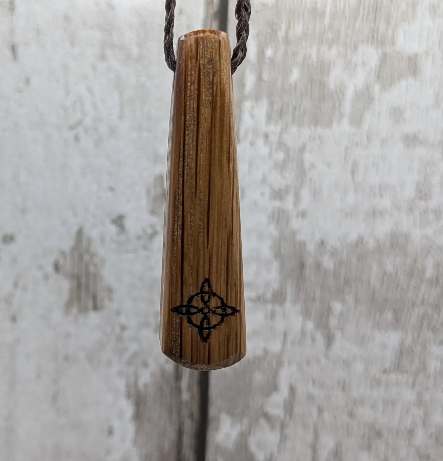 Whiskey barrel oak tear drop pendant with laser printed with rune symbol.