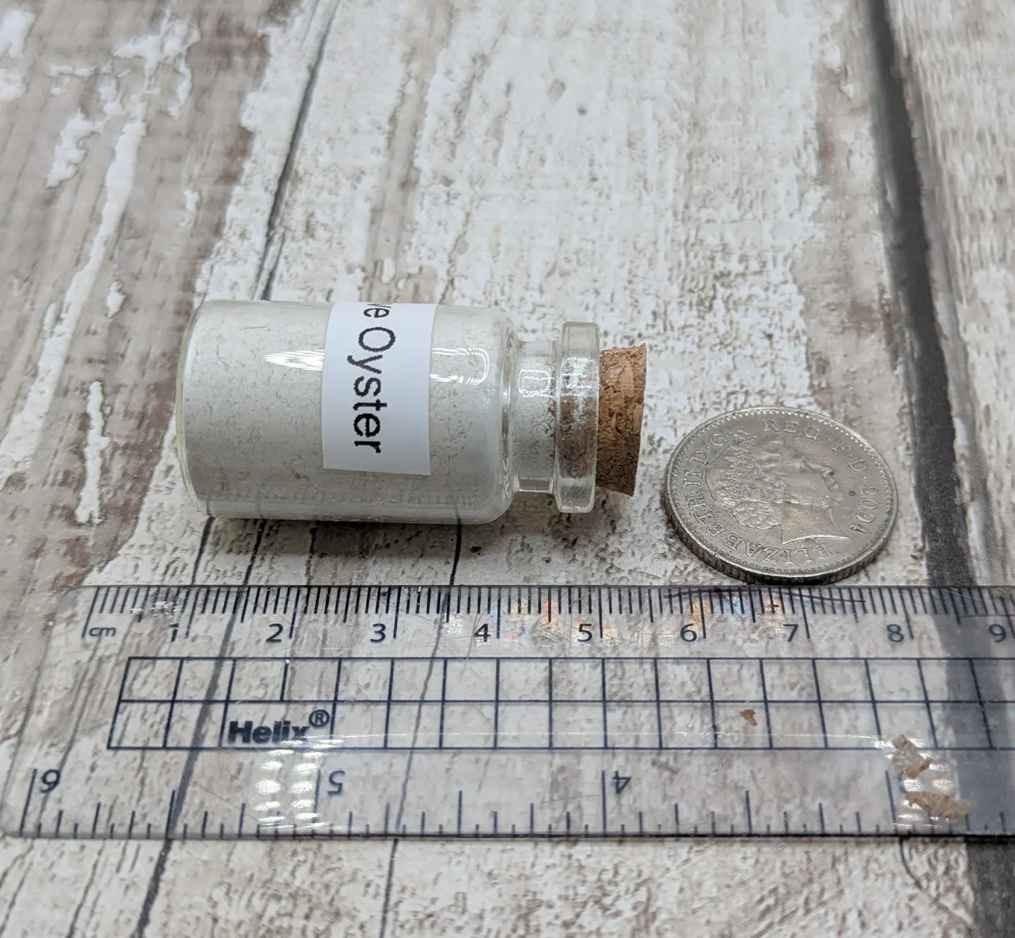 Unrefined powdered peach native oyster shell paint pigment.