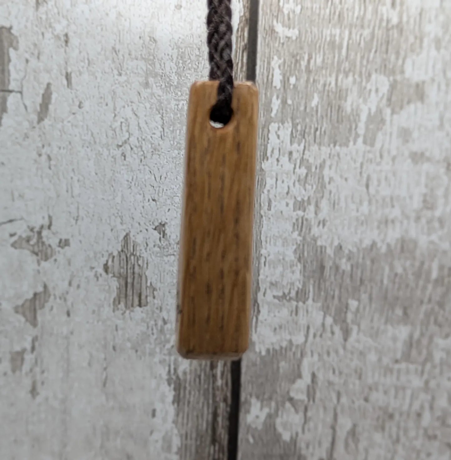 Whiskey barrel oak tear drop pendant with laser printed with rune symbol.