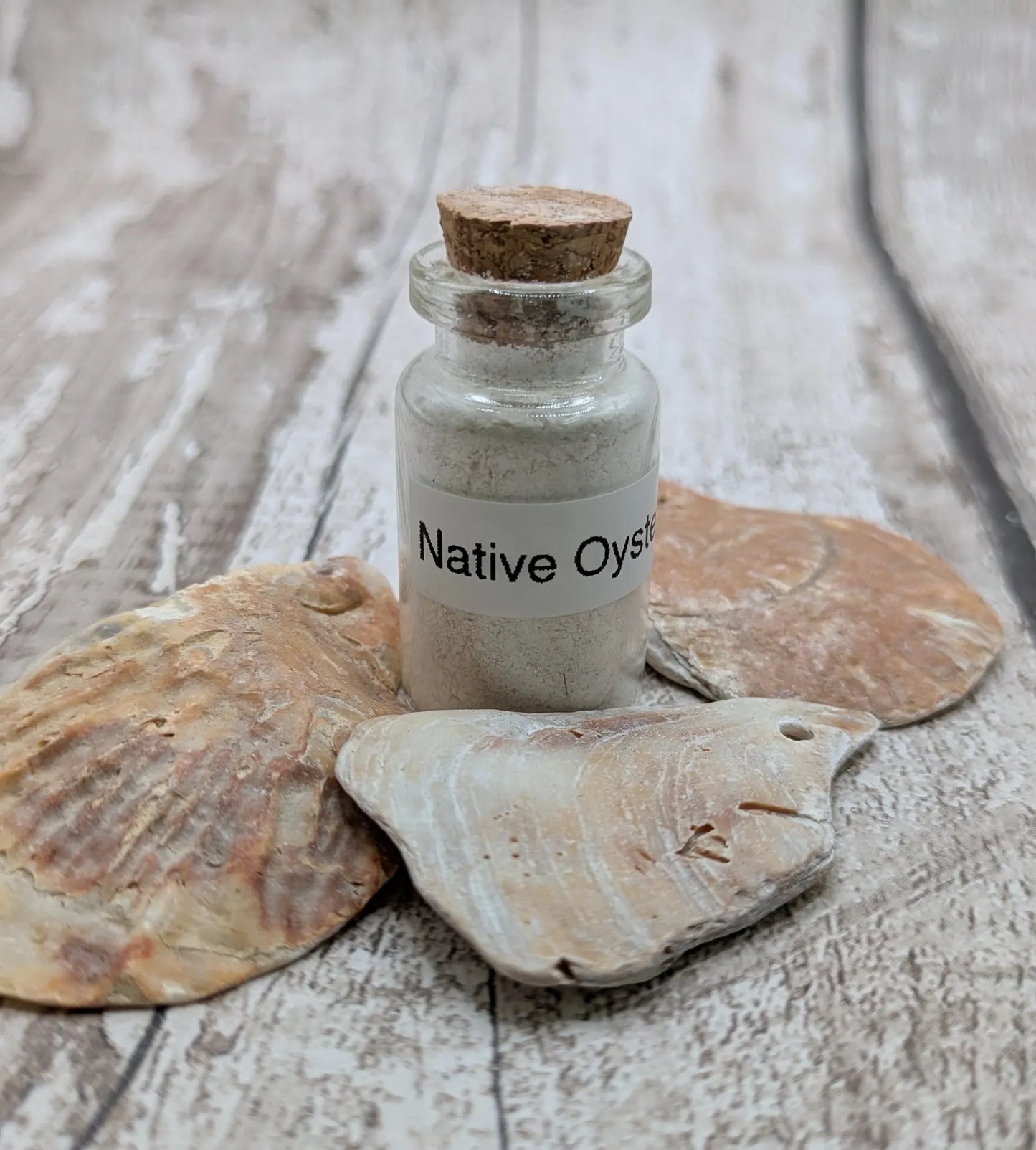 Unrefined powdered peach native oyster shell paint pigment.
