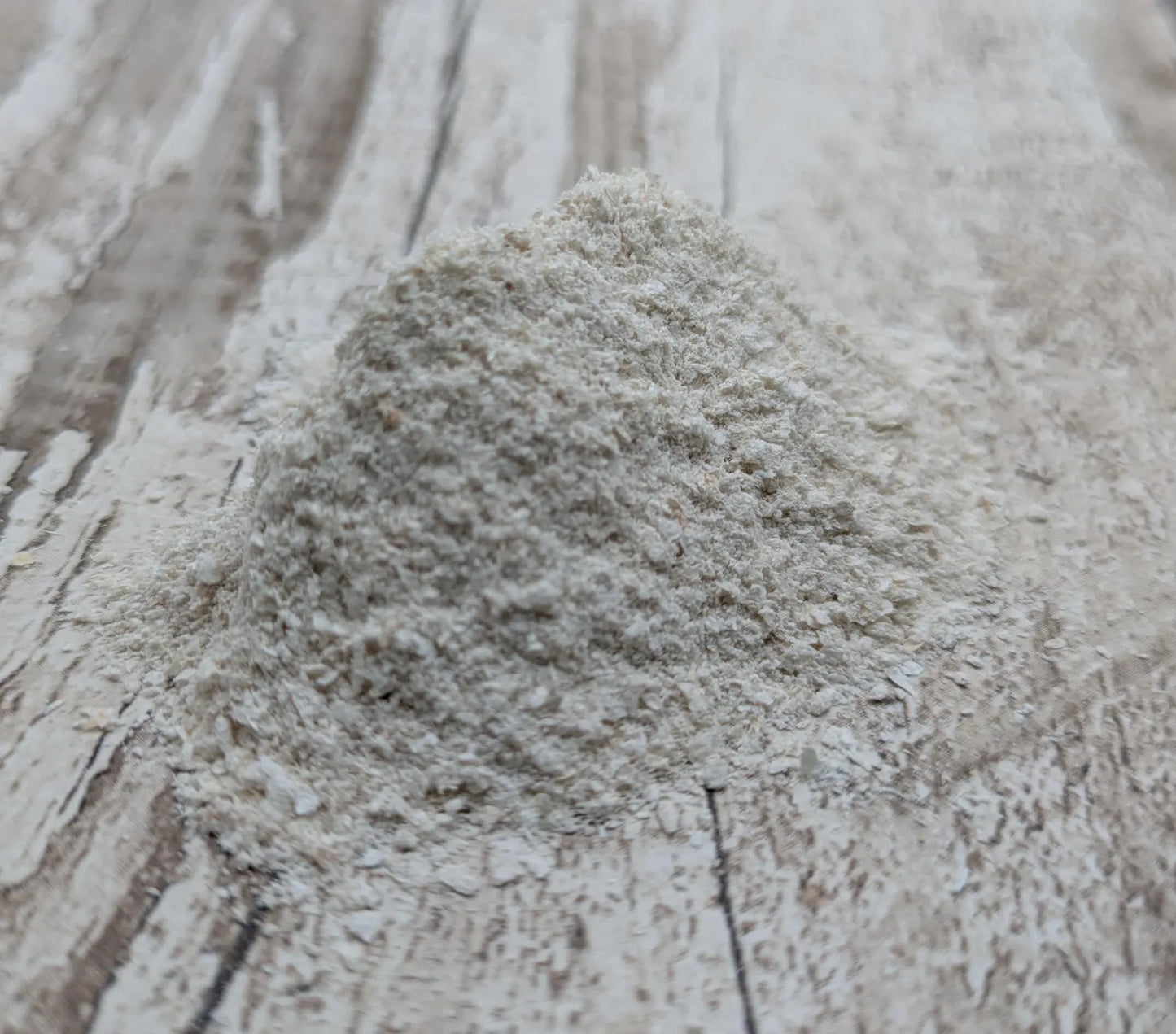 Unrefined powdered peach native oyster shell paint pigment.