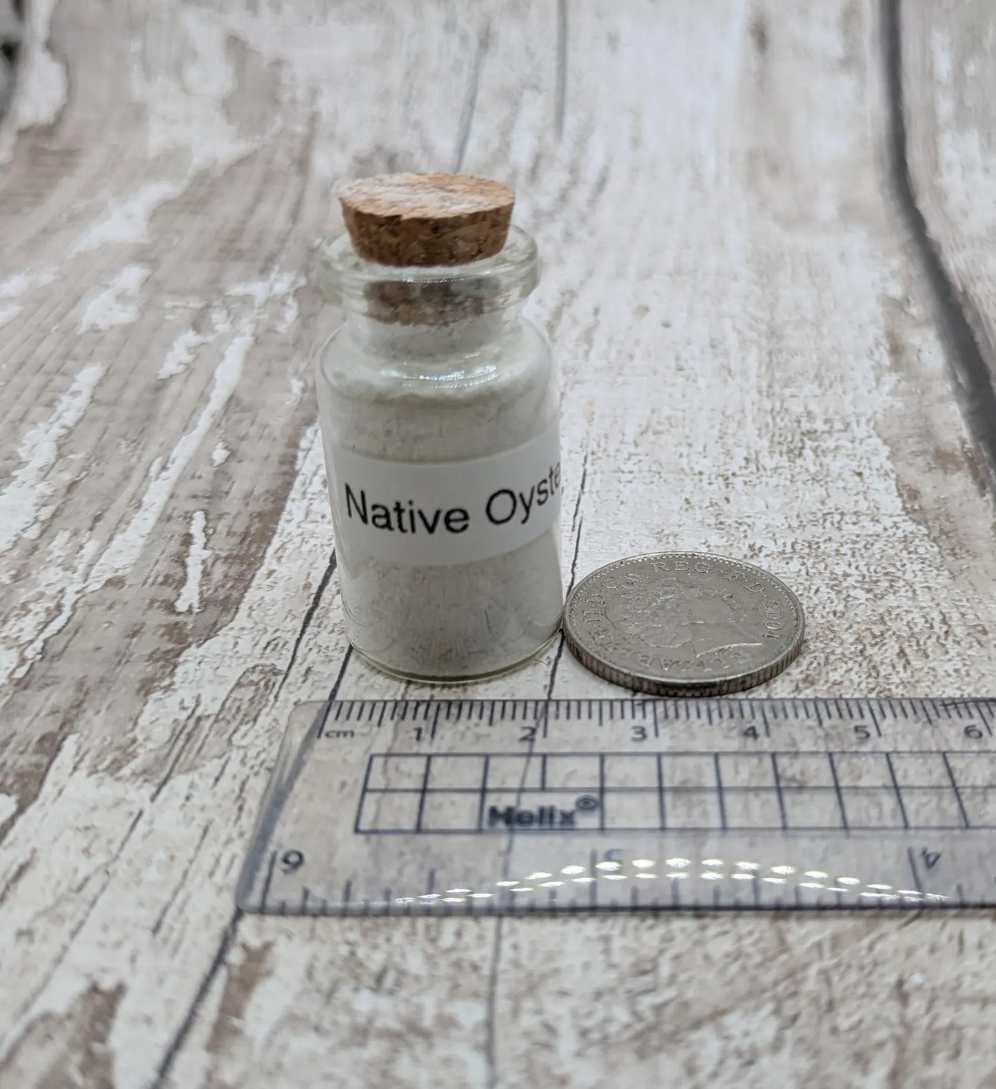 Unrefined powdered peach native oyster shell paint pigment.