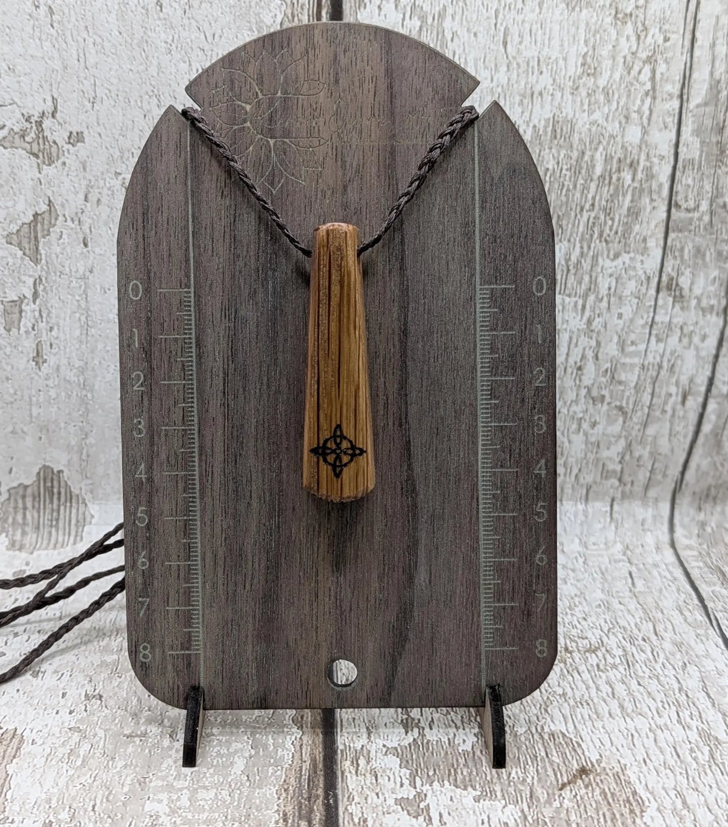 Whiskey barrel oak tear drop pendant with laser printed with rune symbol.