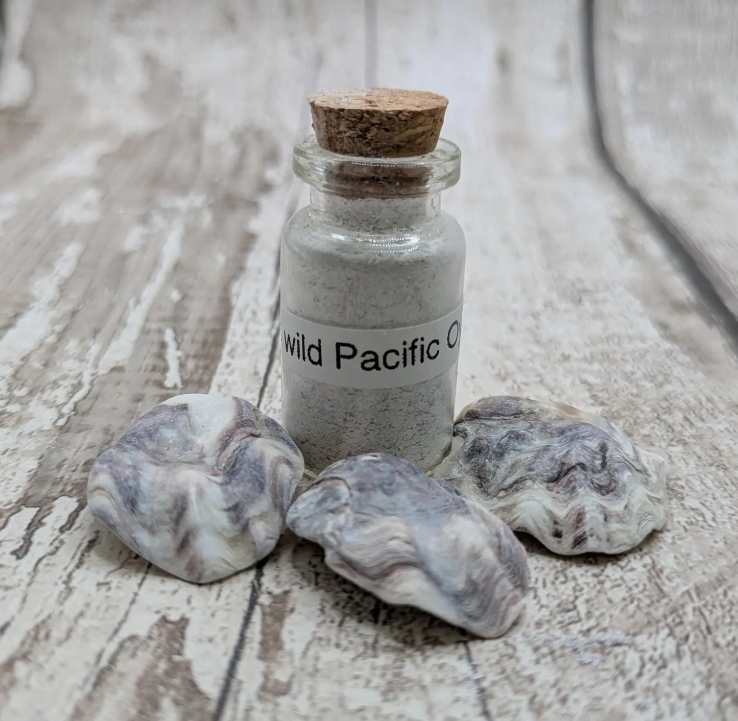 unrefined Pacific Oyster powder pigment with purple tint.