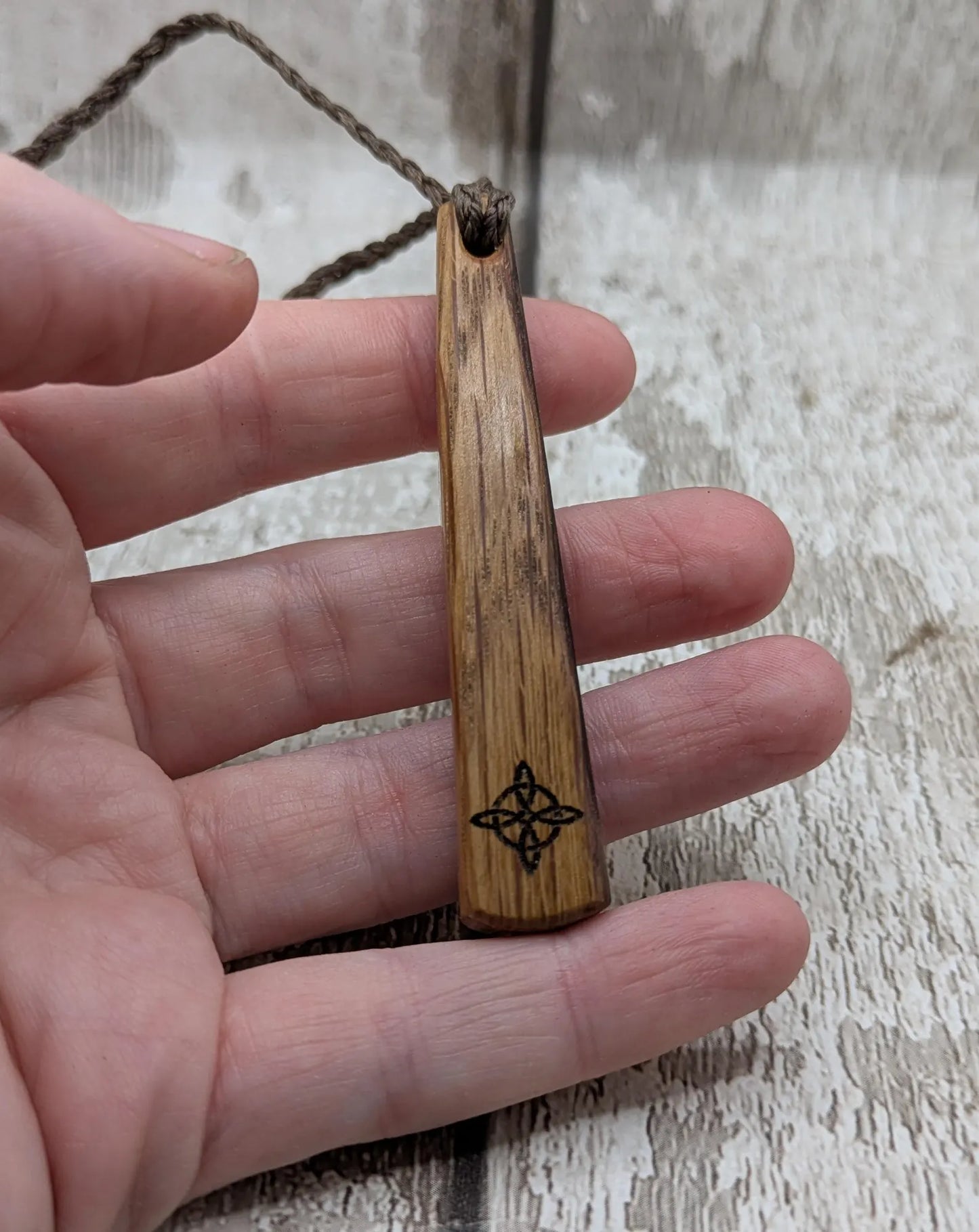 Whiskey barrel oak tear drop pendant with laser printed with rune symbol.