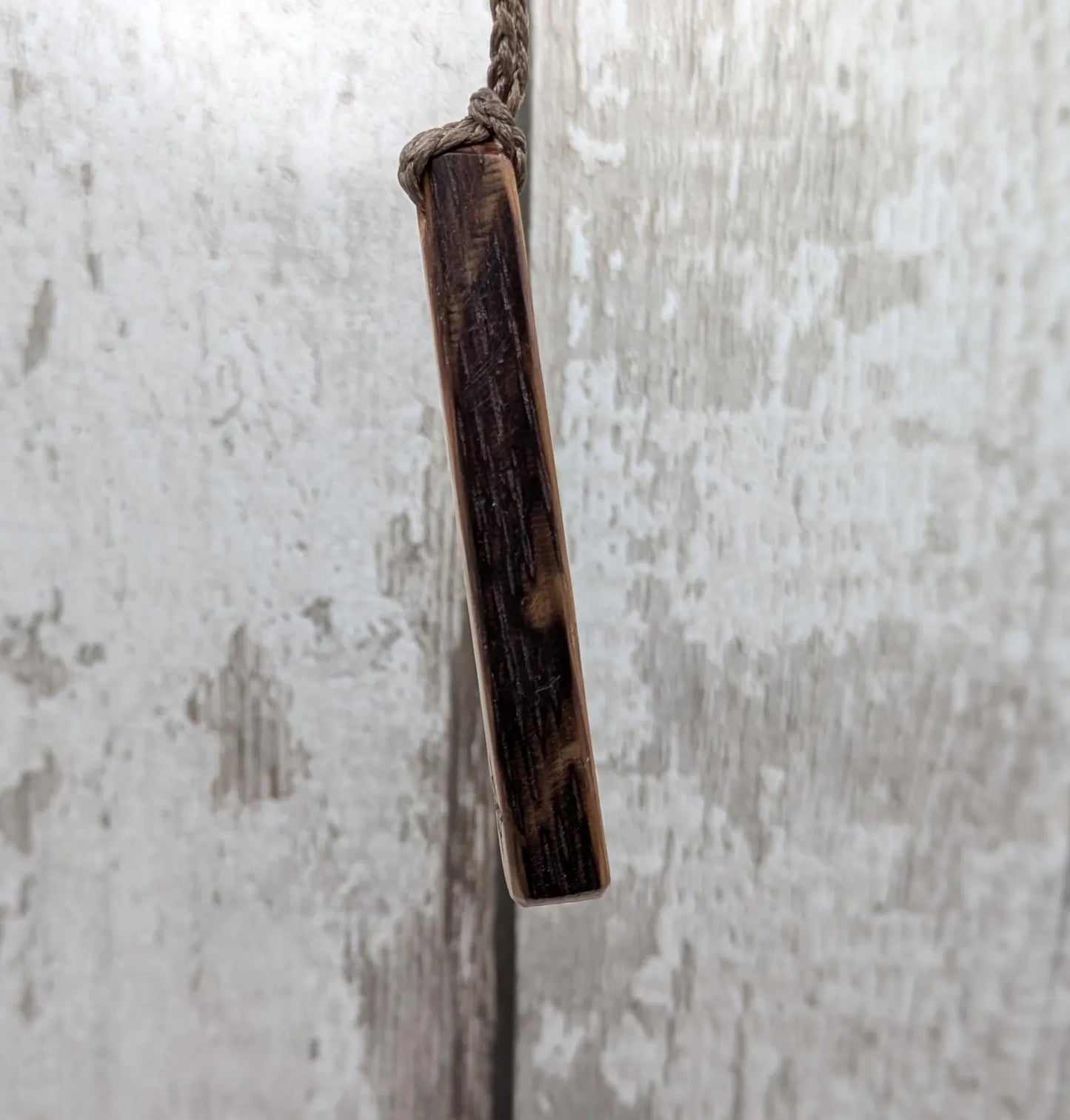 Whiskey barrel oak tear drop pendant with laser printed with rune symbol.