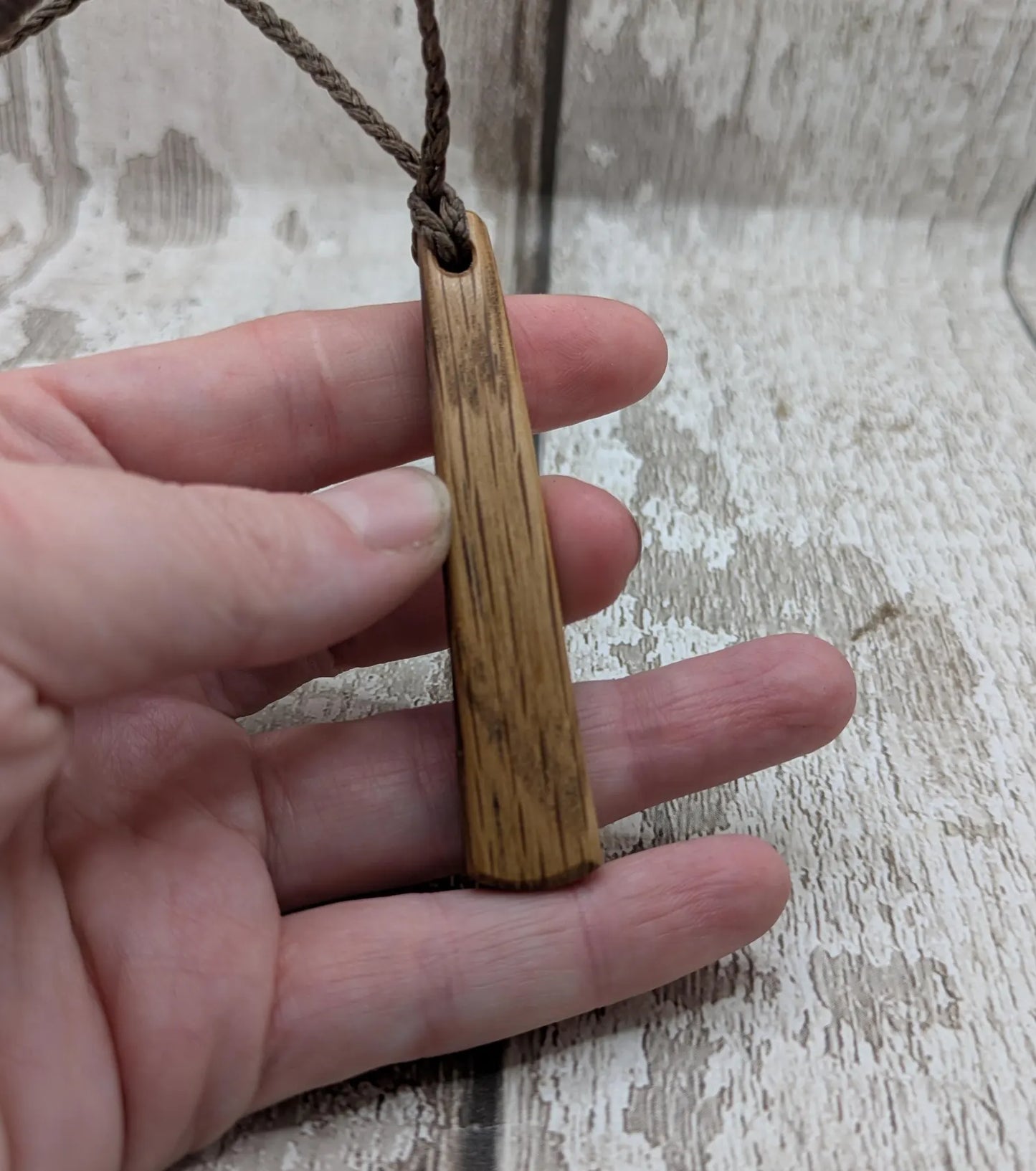 Whiskey barrel oak tear drop pendant with laser printed with rune symbol.