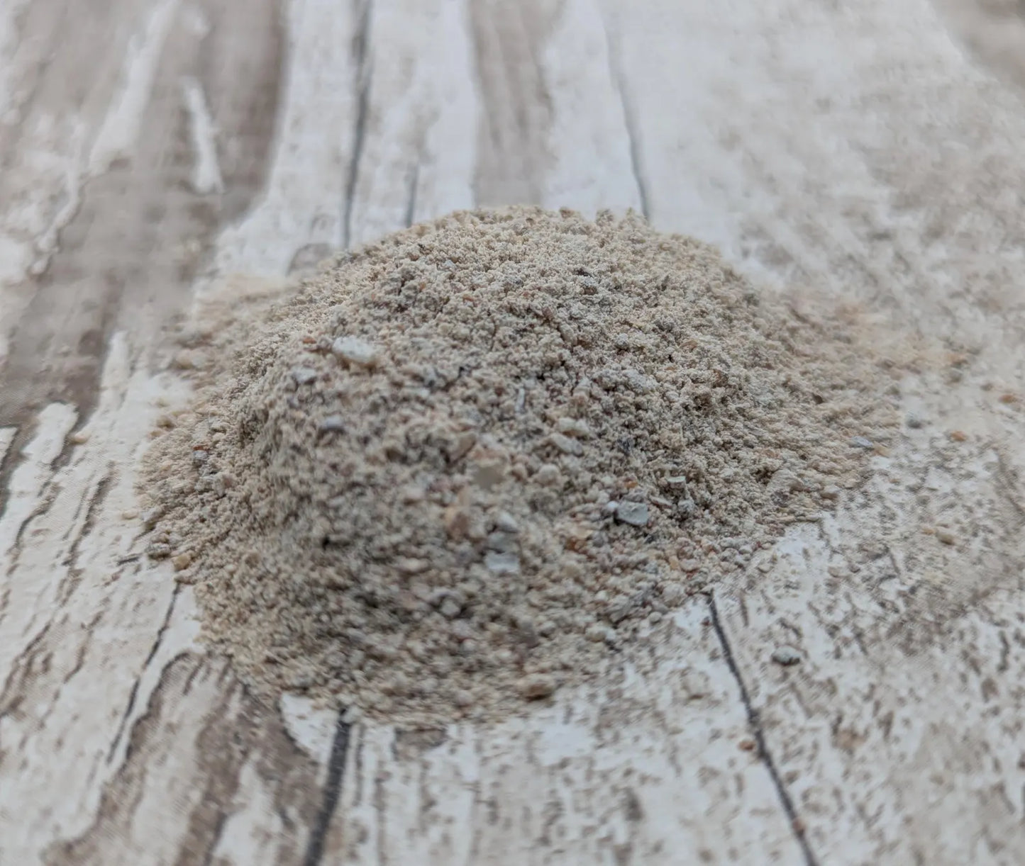 Unrefined powdered pink periwinkle shell pigment.