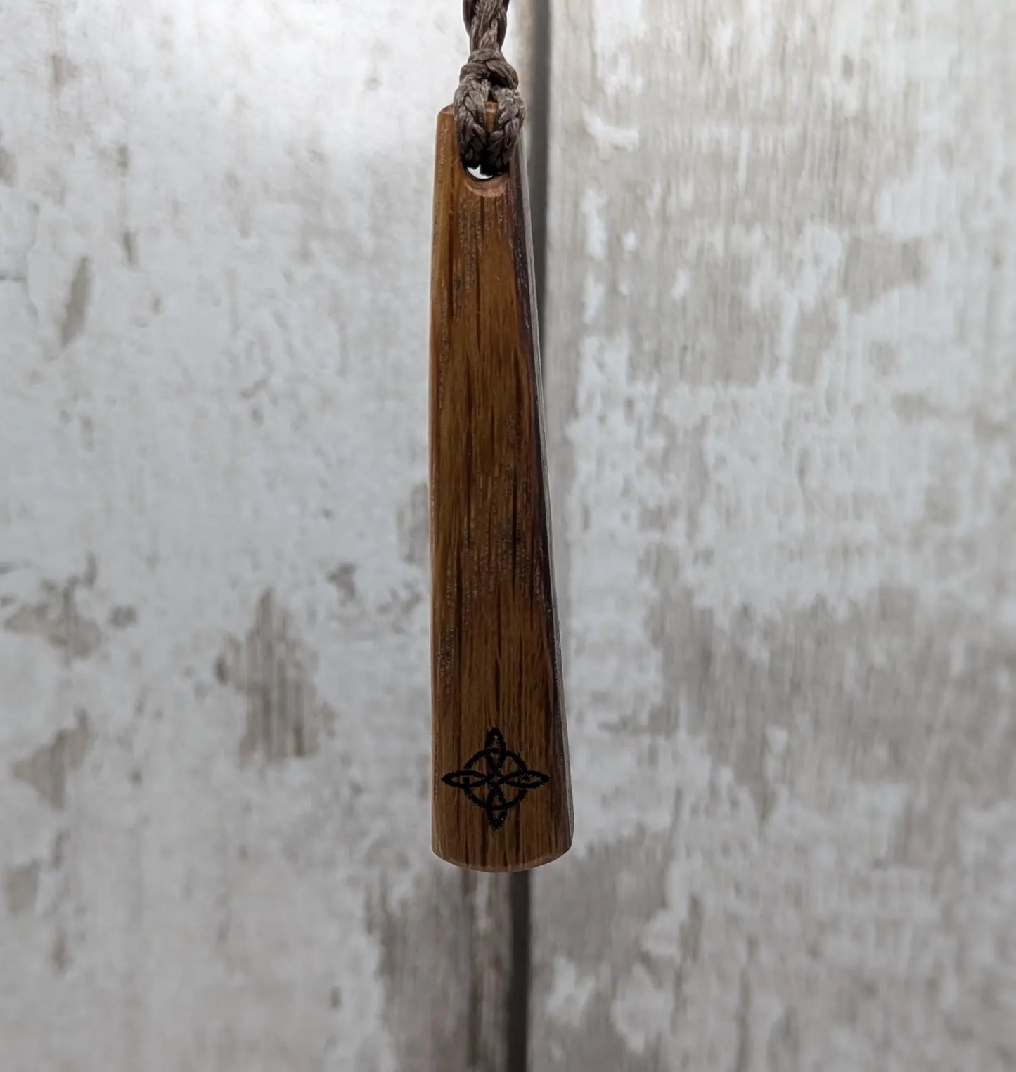 Whiskey barrel oak tear drop pendant with laser printed with rune symbol.