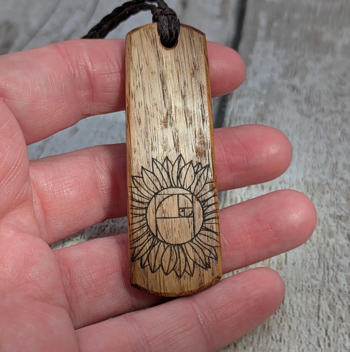 Oak wood pendant with sunflower laser print.