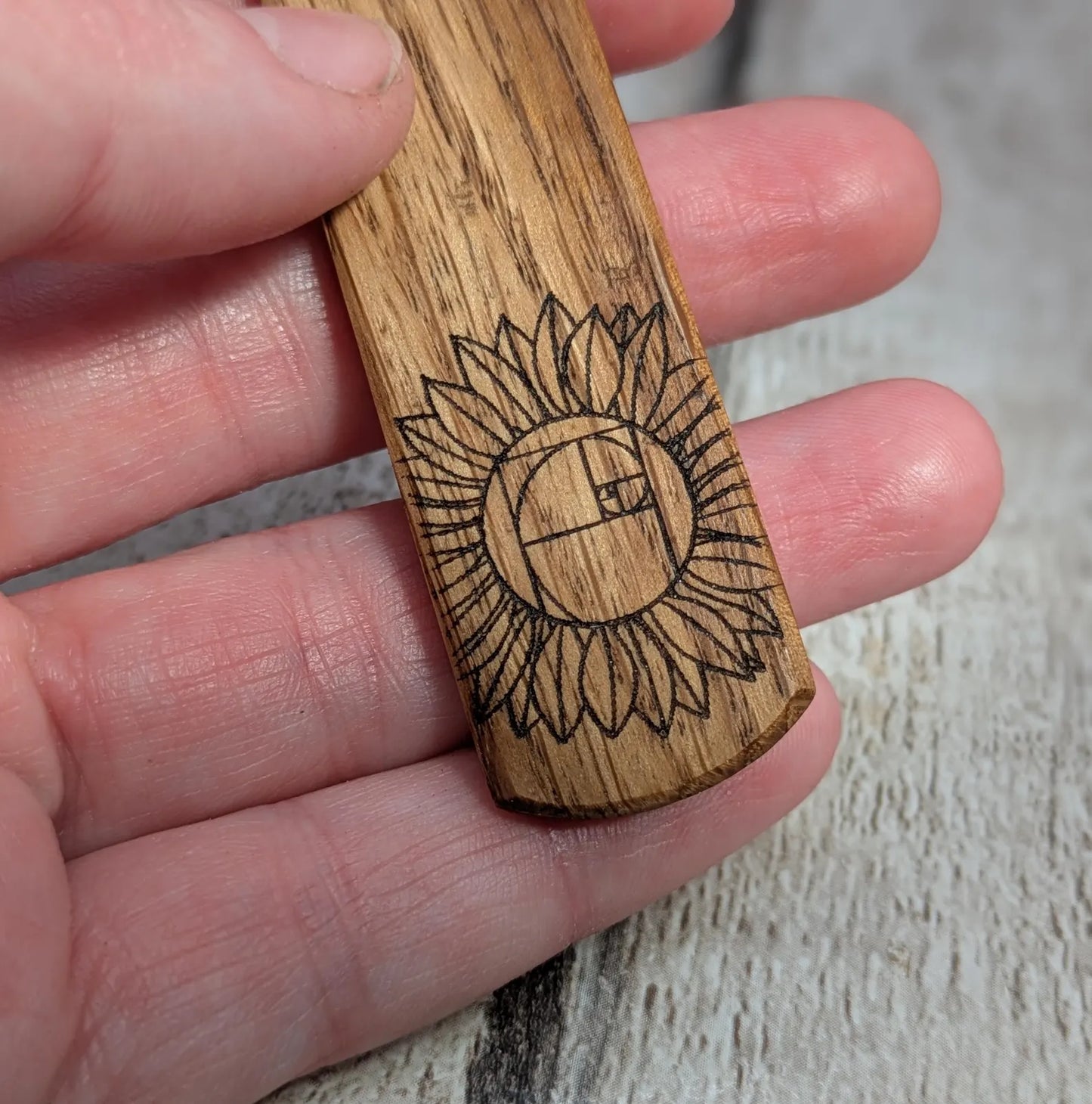 Oak wood pendant with sunflower laser print.