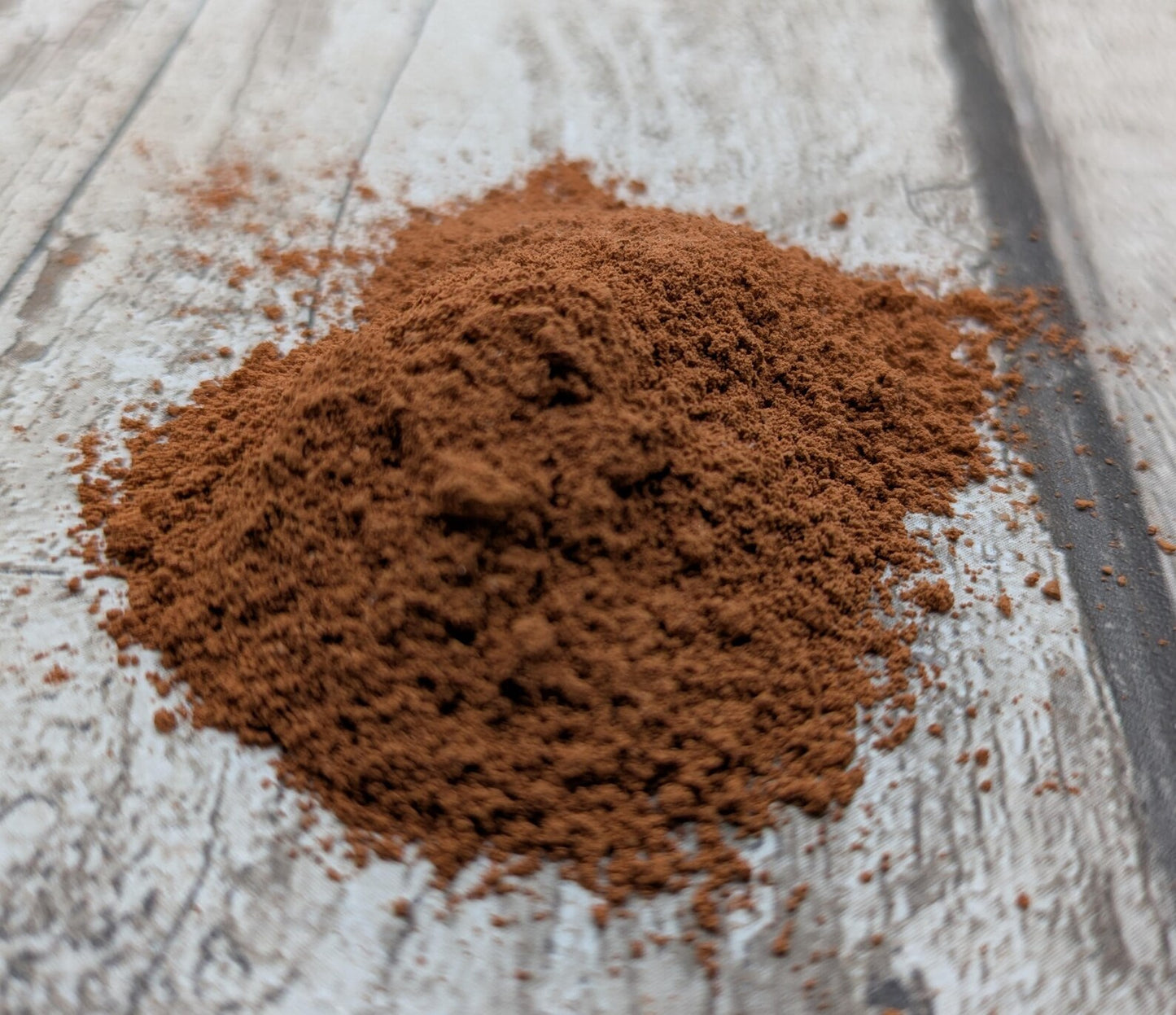Unrefined powdered sea brick paint pigment.