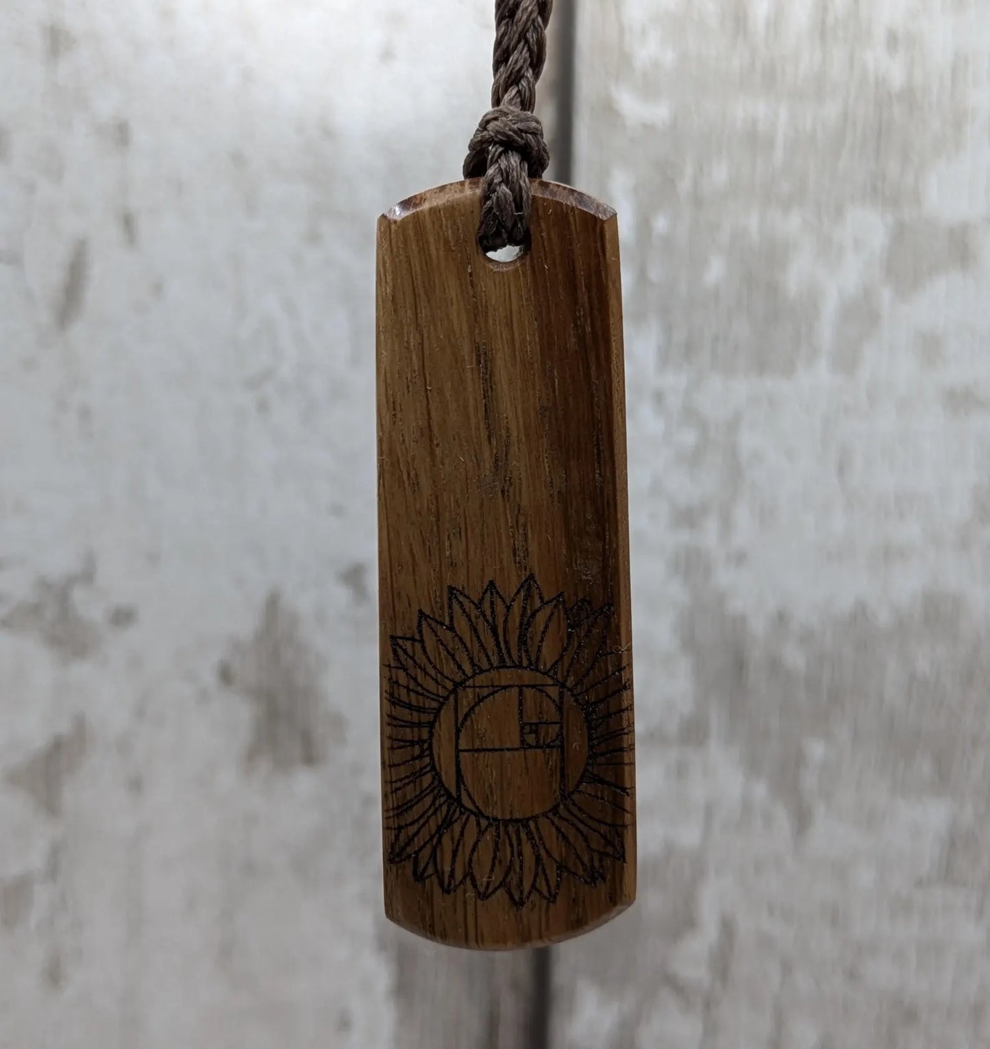 Oak wood pendant with sunflower laser print.