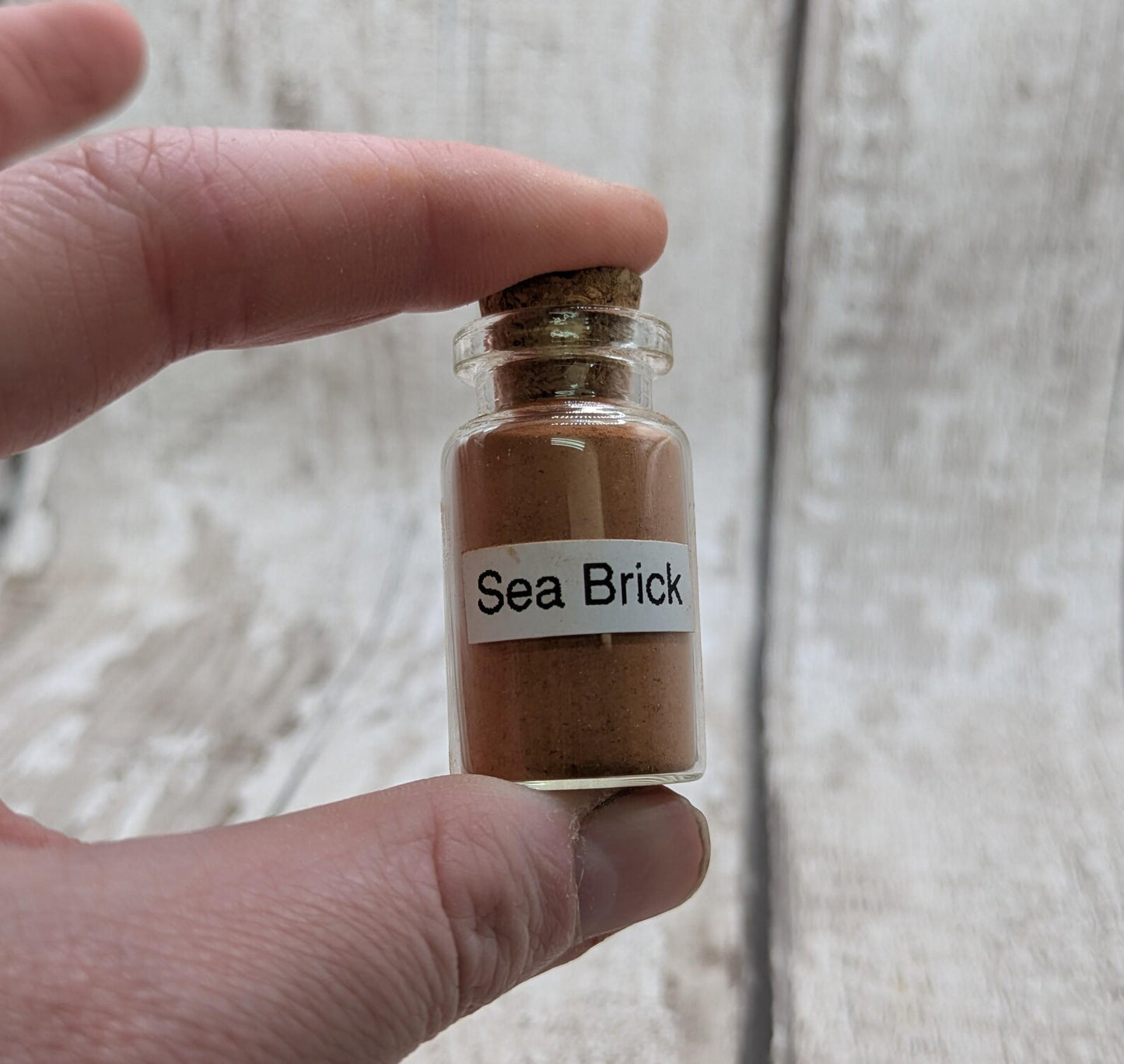 Unrefined powdered sea brick paint pigment.