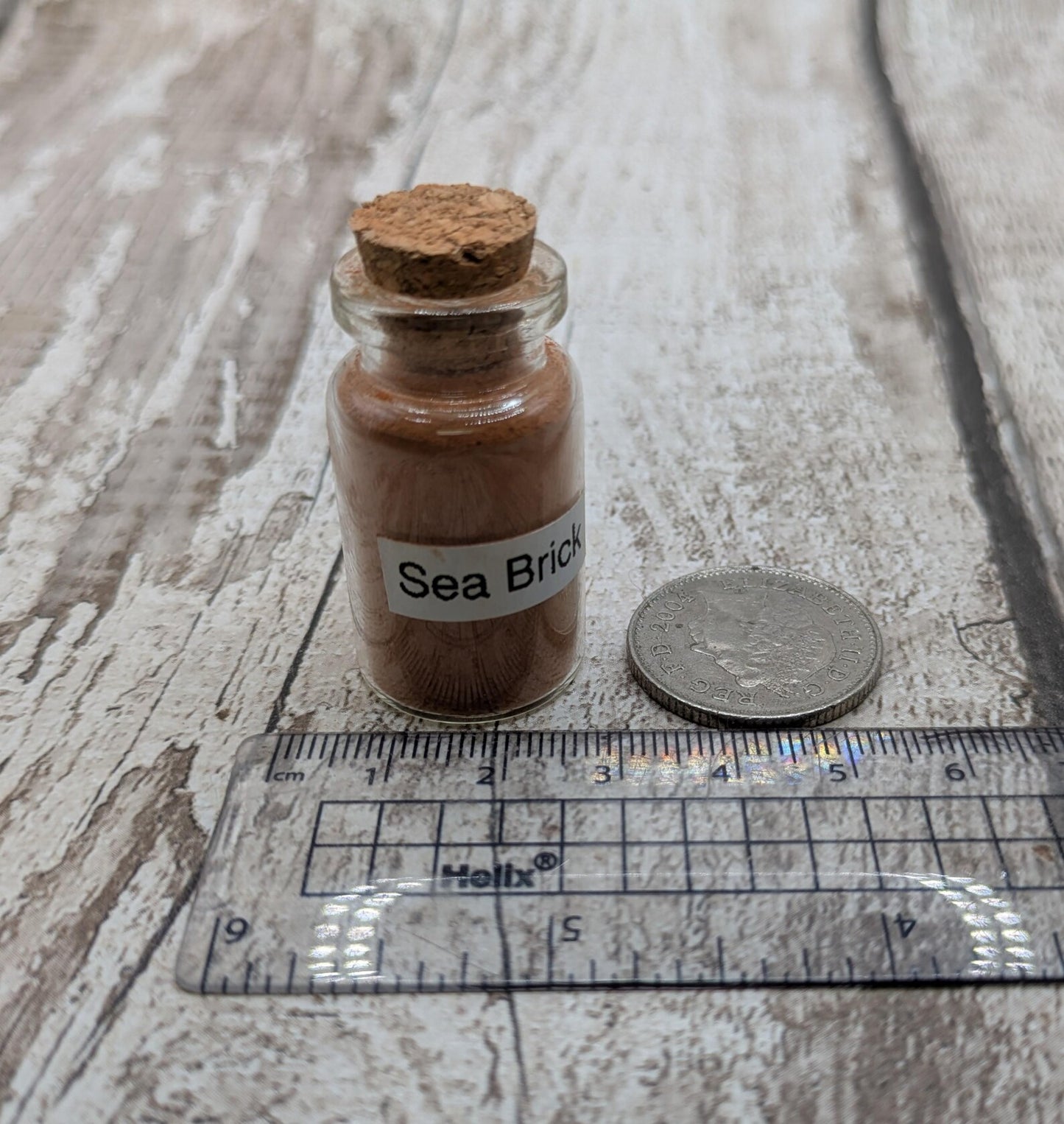 Unrefined powdered sea brick paint pigment.
