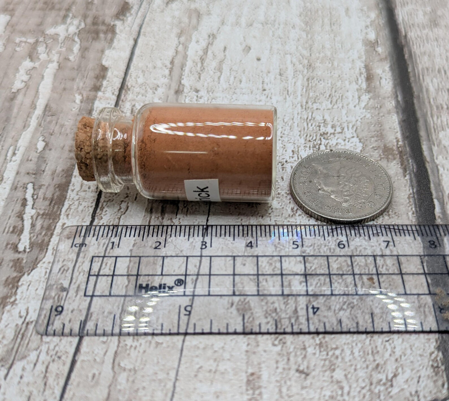 Unrefined powdered sea brick paint pigment.