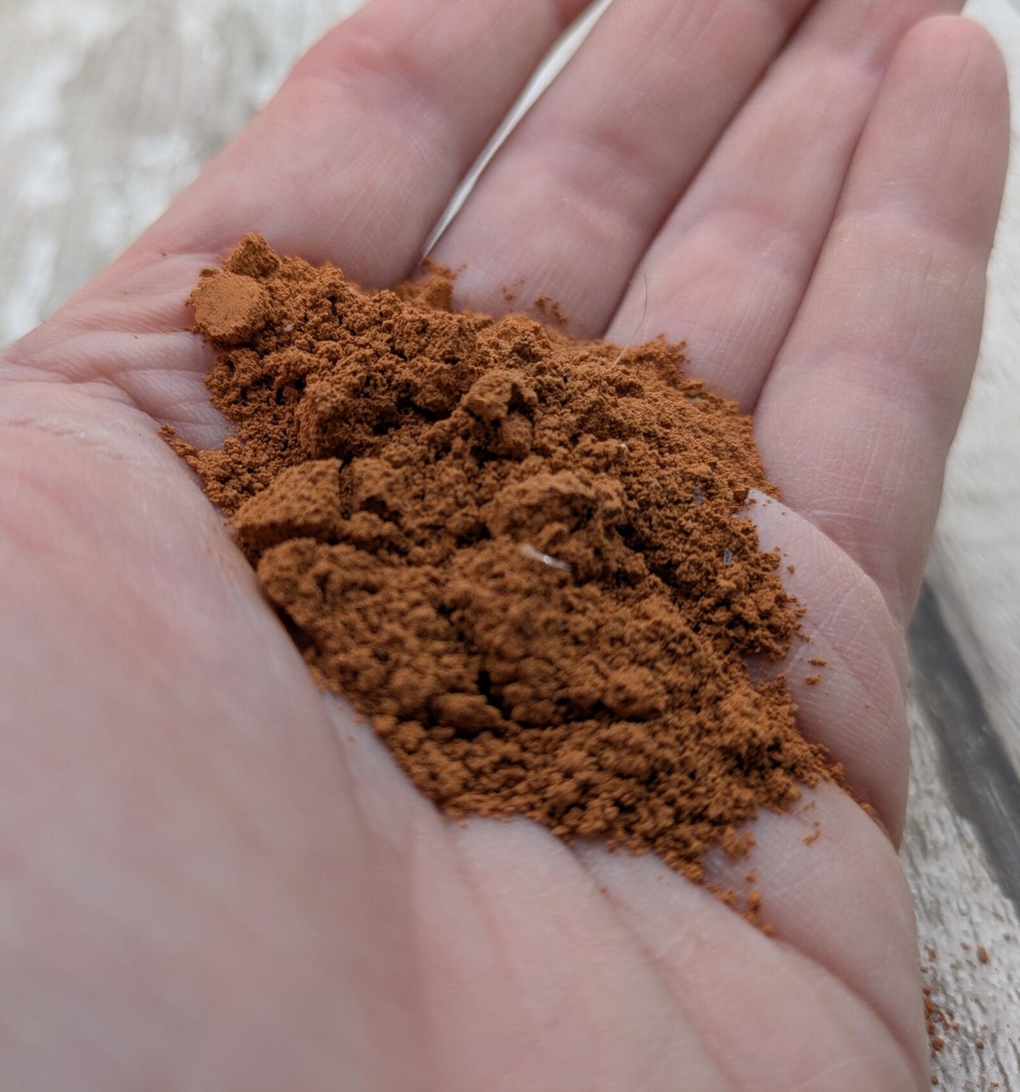 Unrefined powdered sea brick paint pigment.