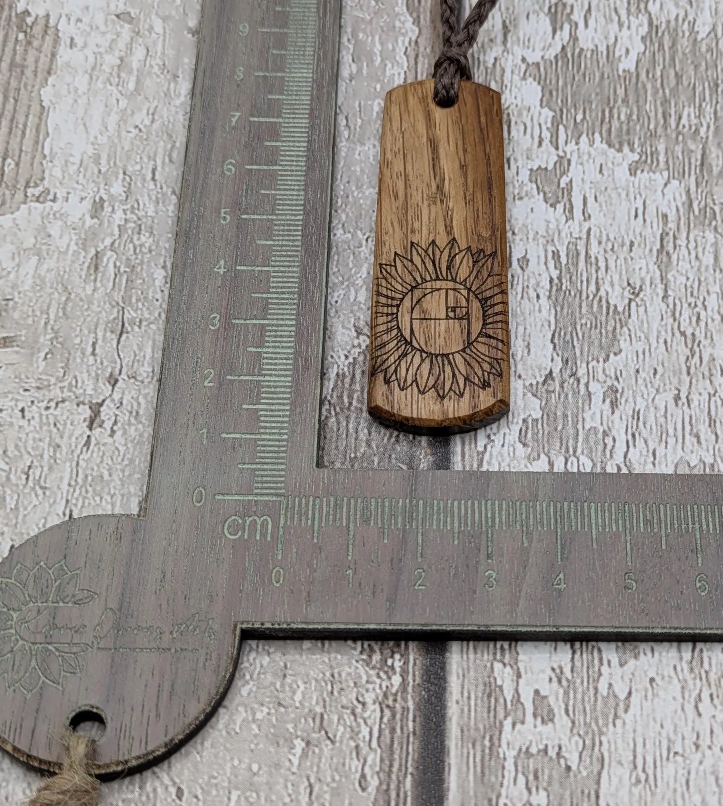 Oak wood pendant with sunflower laser print.