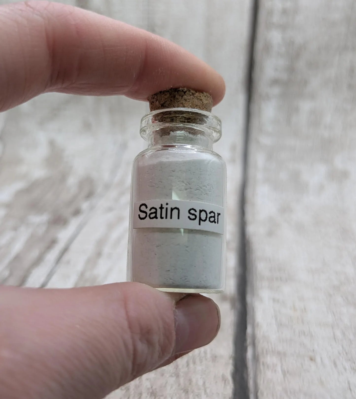 Unrefined powdered satin spar selenite pigment.