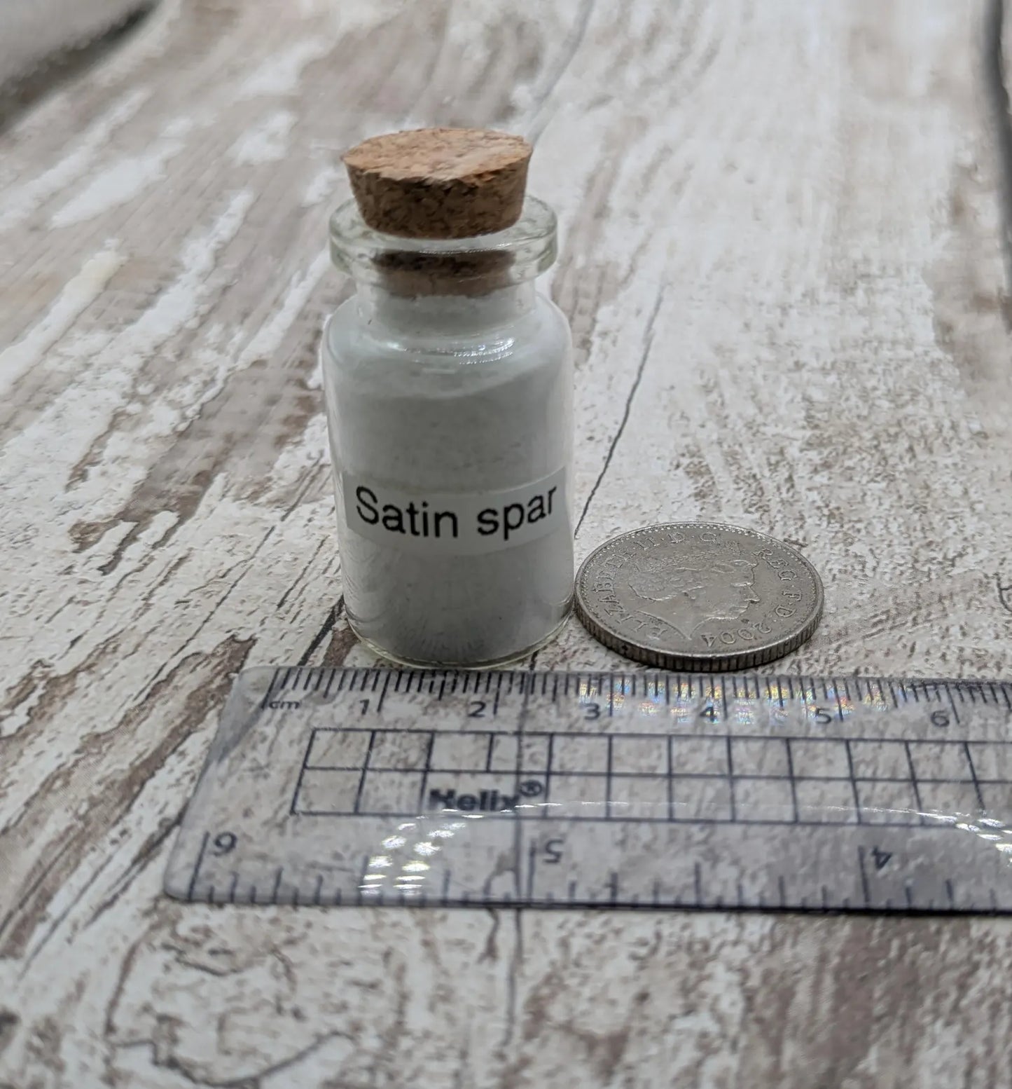 Unrefined powdered satin spar selenite pigment.