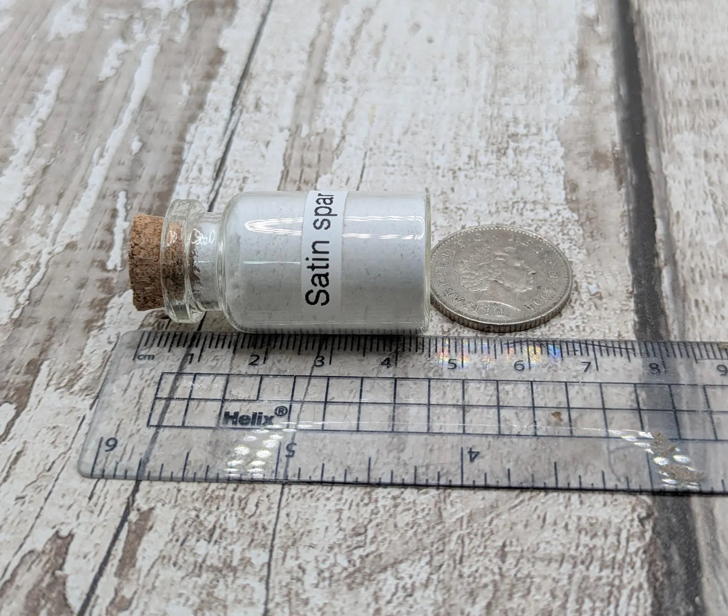 Unrefined powdered satin spar selenite pigment.
