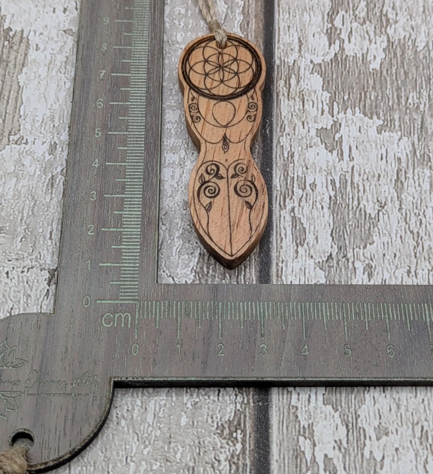 Yew wood tattooed goddess laser printed pendant.