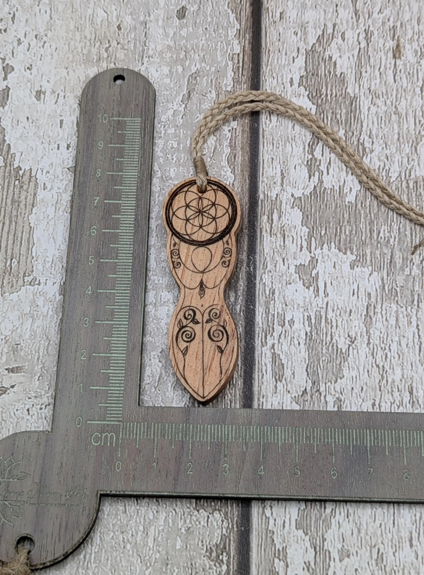 Yew wood tattooed goddess laser printed pendant.