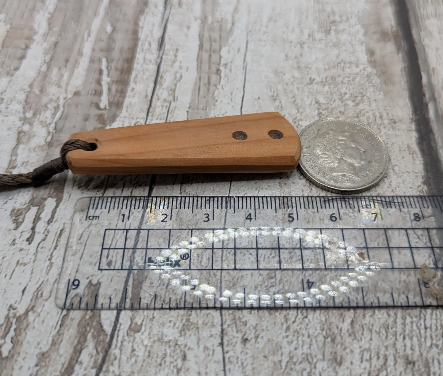 Yew Wood roimata drop pendant with Moldavite Inlay.