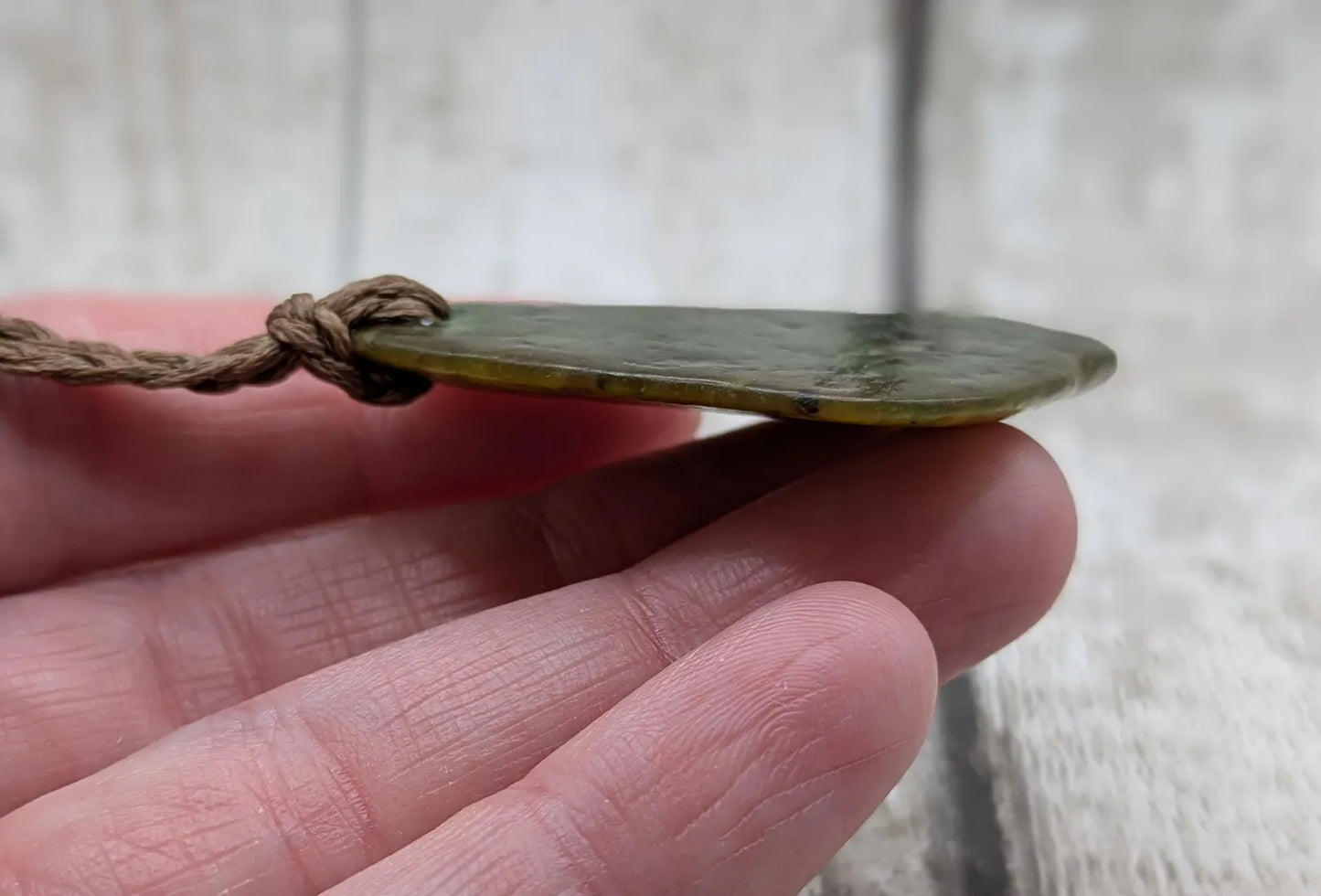 nz tumbled pounamu greenstone jade pendant.