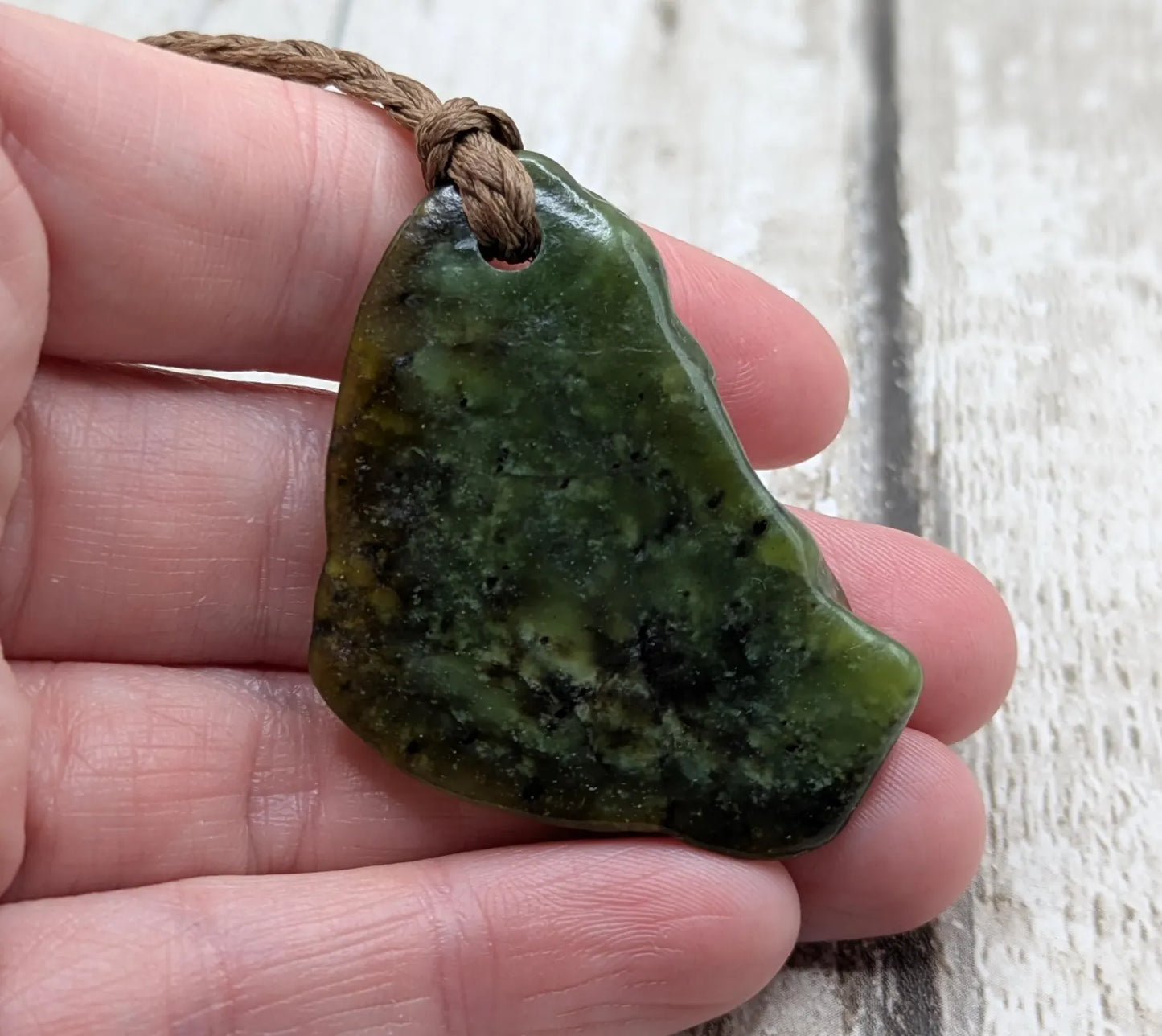 nz tumbled pounamu greenstone jade pendant.