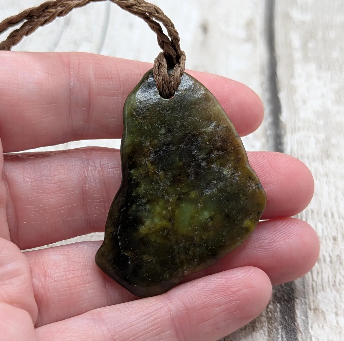 nz tumbled pounamu greenstone jade pendant.