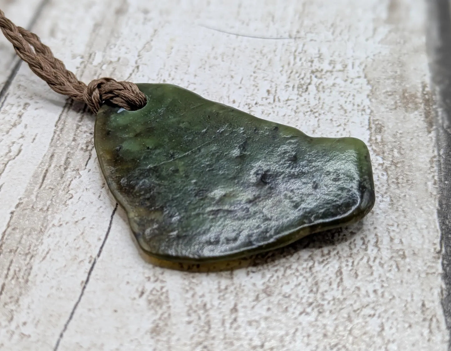 nz tumbled pounamu greenstone jade pendant.