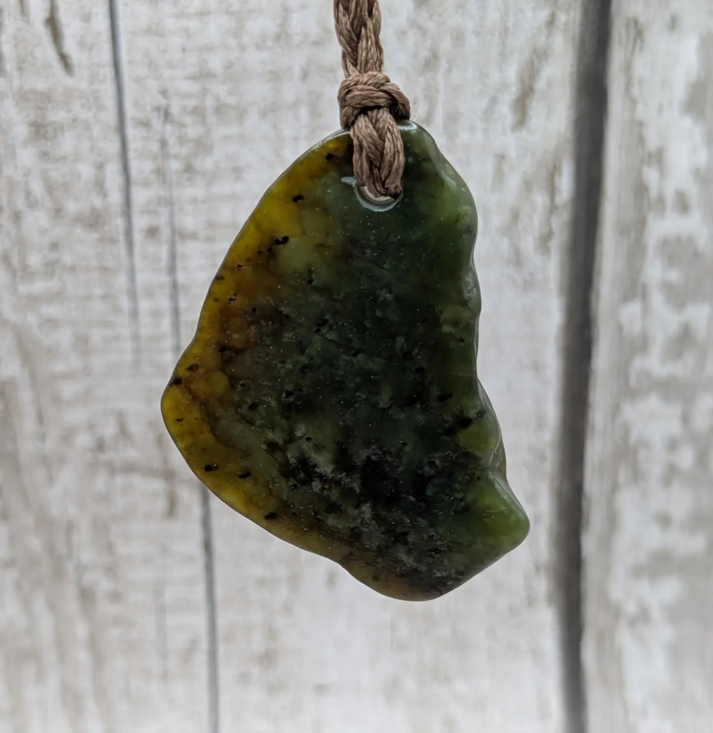 nz tumbled pounamu greenstone jade pendant.