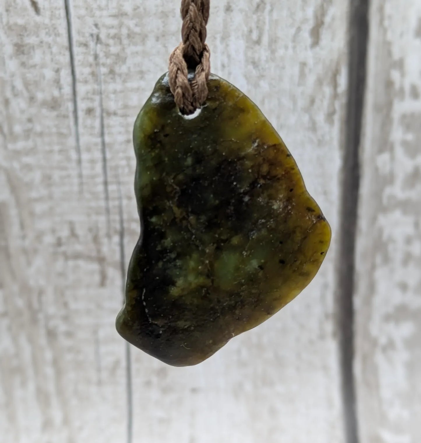 nz tumbled pounamu greenstone jade pendant.