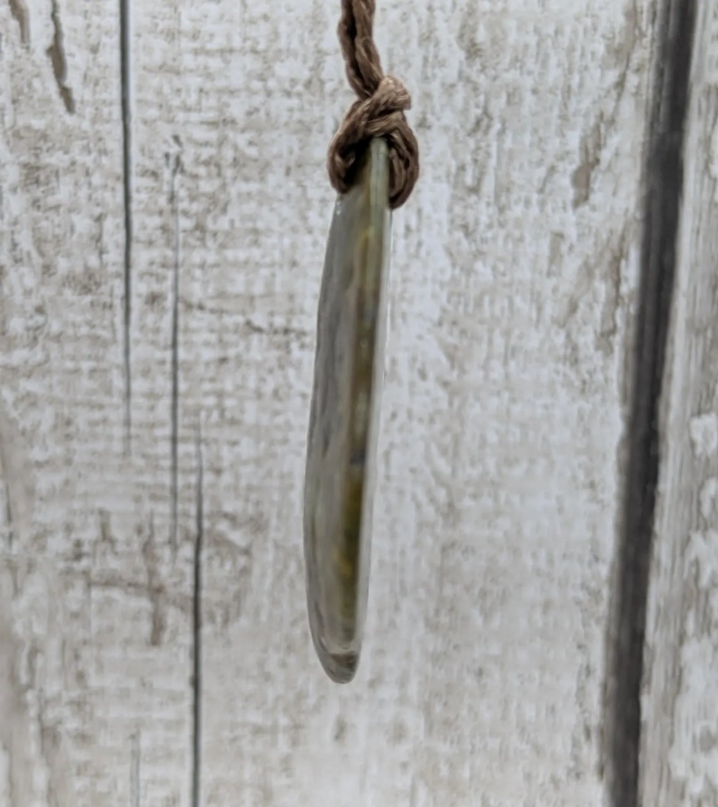 nz tumbled pounamu greenstone jade pendant.