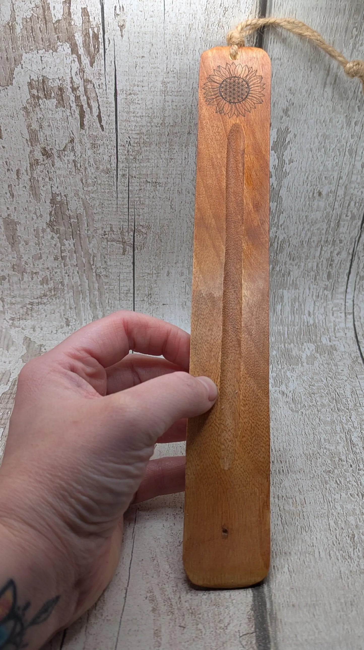 Recycled mango wood laser printed incense stick holders.