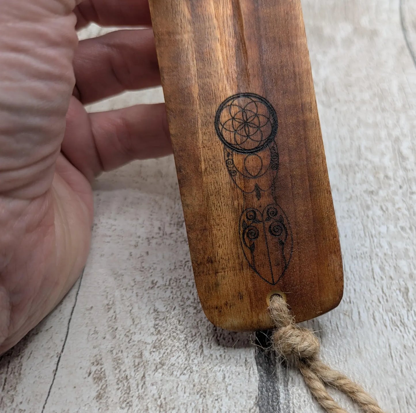 Recycled mango wood laser printed incense stick holders.