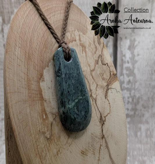 New Zealand Pounamu jade Hei Toki adze styled pendant.