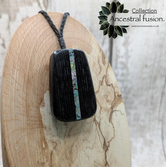 Fenland bog pendant with pāua shell inlay.