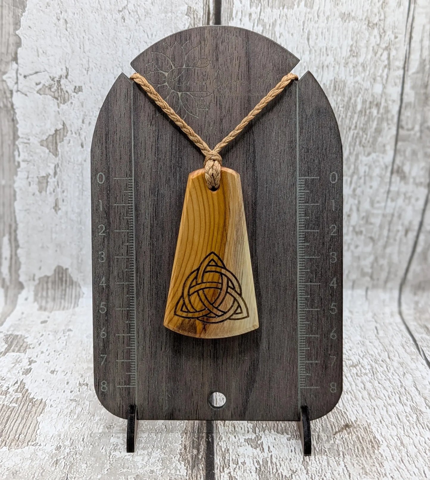 Yew wood triskelion laser printed pendant.