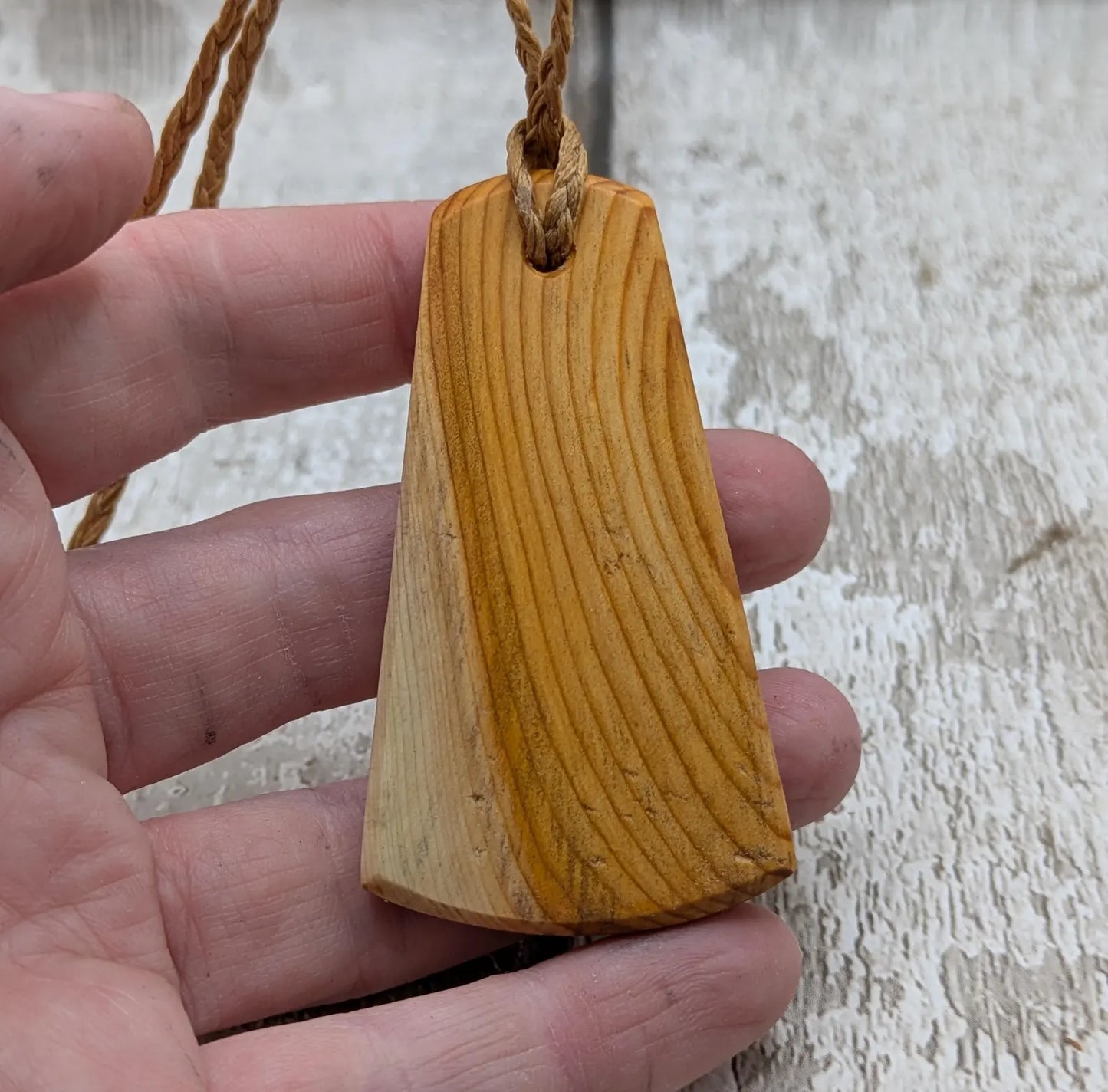 Yew wood triskelion laser printed pendant.