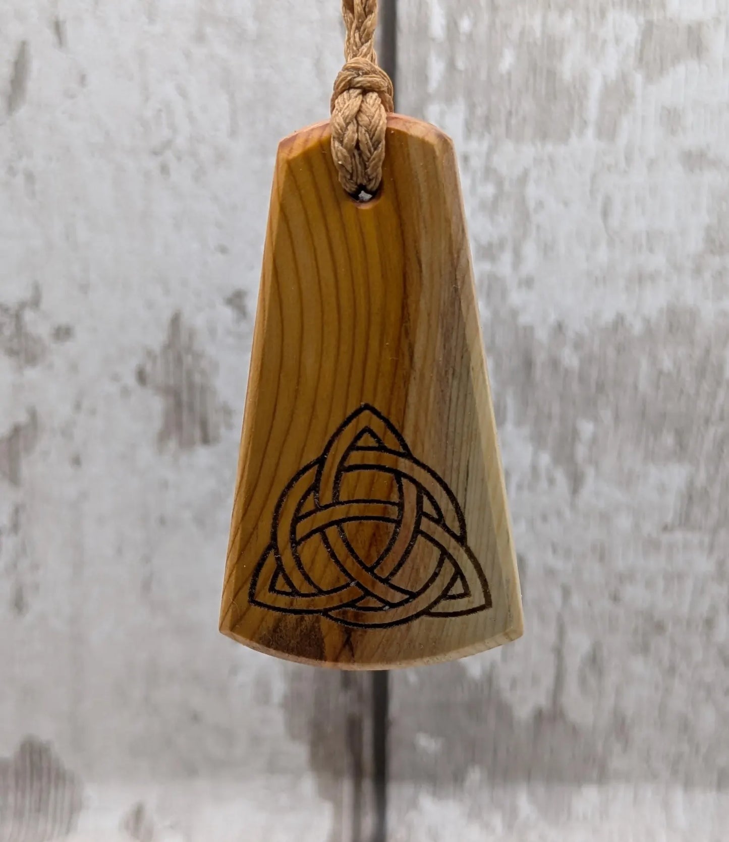 Yew wood triskelion laser printed pendant.