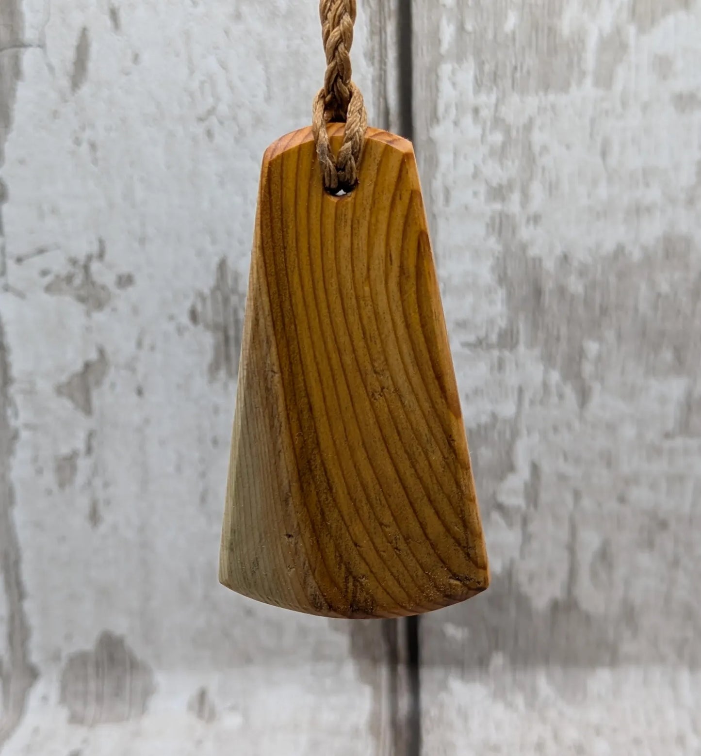 Yew wood triskelion laser printed pendant.